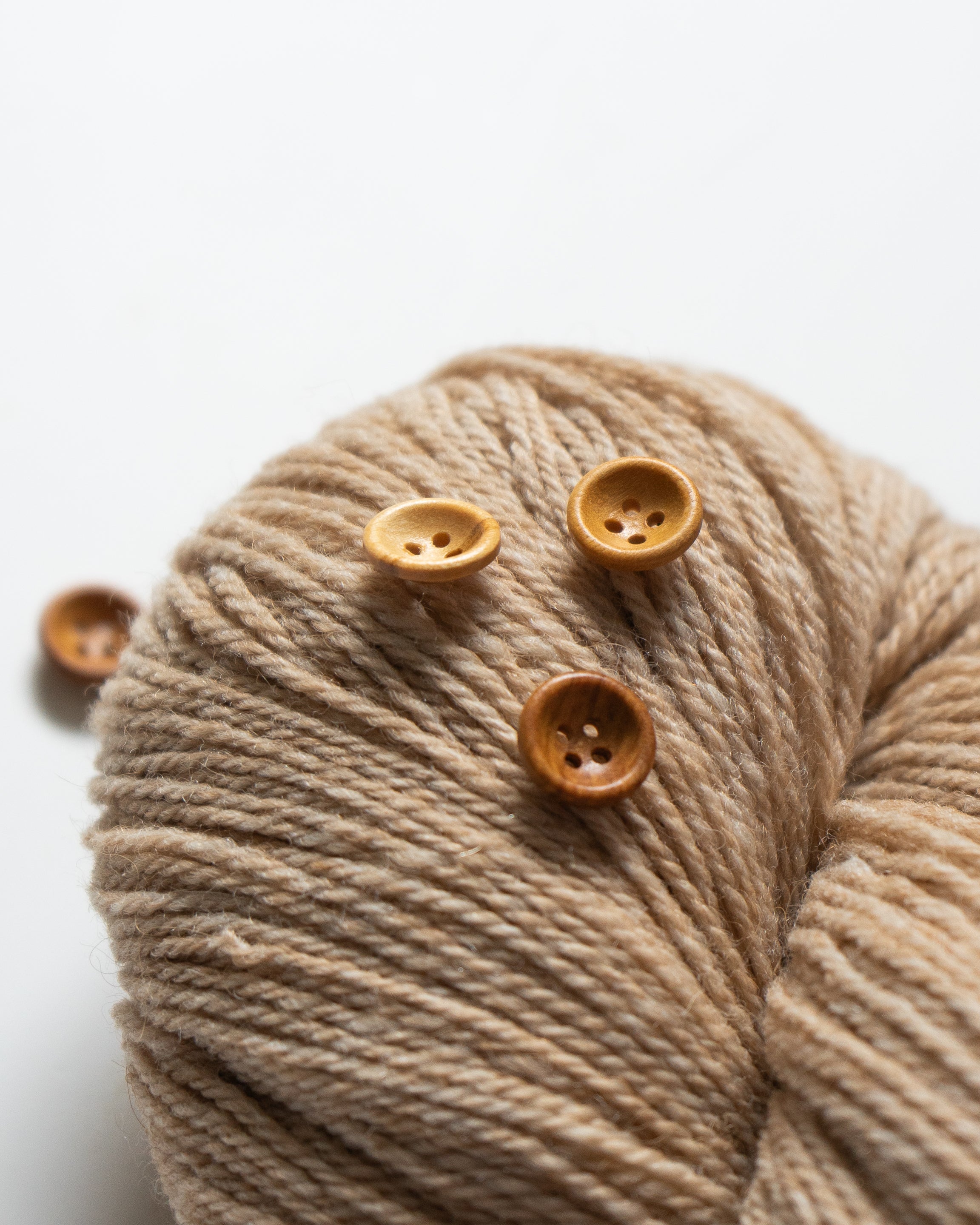Riley <br/><small>12mm Wood Button</small>