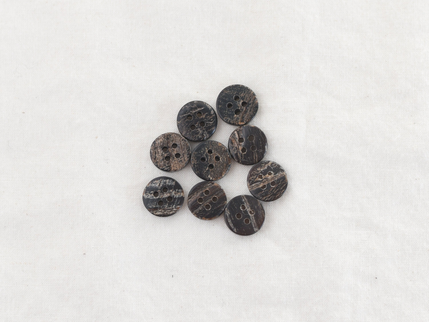 Earlie <br/><small>12mm Buffalo Horn Button</small>